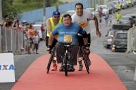 Atleta cadeirante se superando para chegar na final da 22ª Meia Maratona de Joinville com o tempo de 41:05 = percursso ded 6,600km. - Fotografo: Phelippe José - Data: 14/03/2015